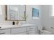 Bright, clean bathroom with a white vanity, gold accents, and a modern faucet at 4210 Provenance Trl, Cumming, GA 30028
