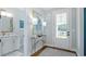 Stylish bathroom featuring a modern vanity, elegant lighting, and a glass-door entry at 4210 Provenance Trl, Cumming, GA 30028