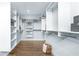 Spacious walk-in closet with custom shelving, ample storage space, and hardwood floors at 4210 Provenance Trl, Cumming, GA 30028