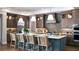 Spacious kitchen featuring a large island, modern appliances, and stylish pendant lighting at 4210 Provenance Trl, Cumming, GA 30028