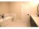 Modern bathroom featuring a standalone tub, stylish fixtures, and elegant tile work at 502 Clover Ln, Alpharetta, GA 30009