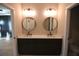 Modern bathroom with a double vanity and round mirrors at 502 Clover Ln, Alpharetta, GA 30009