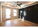 Large bedroom featuring hardwood floors, a ceiling fan, and a bright door at 502 Clover Ln, Alpharetta, GA 30009