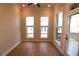 Bright bedroom featuring hardwood floors, natural light, and neutral walls at 502 Clover Ln, Alpharetta, GA 30009