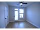 Bright bedroom with hardwood floors, ceiling fan and access to a balcony or patio at 502 Clover Ln, Alpharetta, GA 30009