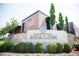 Exterior view of the Avalon mixed-use development, featuring a brick building with attractive landscaping at 502 Clover Ln, Alpharetta, GA 30009