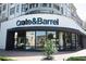 Exterior of Crate & Barrel store with a curved window facade and landscaping at 502 Clover Ln, Alpharetta, GA 30009