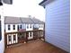 View from wood deck showing well-maintained exteriors of nearby townhomes at 502 Clover Ln, Alpharetta, GA 30009
