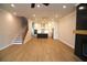 Open-concept living space with a modern kitchen and a view of the staircase at 502 Clover Ln, Alpharetta, GA 30009