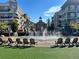 Community town square featuring a water fountain, landscaping, and benches for residents at 502 Clover Ln, Alpharetta, GA 30009