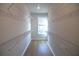 Spacious walk-in closet with ample shelving and a window for natural light at 502 Clover Ln, Alpharetta, GA 30009