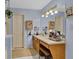 Bathroom vanity area featuring great lighting, a large mirror and beautiful cabinet fixtures at 524 Lambeth Dr, Hiram, GA 30141