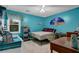 Bedroom painted with teal walls featuring carpeted floor and ceiling fan at 524 Lambeth Dr, Hiram, GA 30141