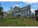 Rear exterior view shows a two-story home with a fenced yard and an attached garage at 524 Lambeth Dr, Hiram, GA 30141