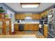 Well-lit kitchen equipped with wooden cabinets and modern appliances for cooking needs at 524 Lambeth Dr, Hiram, GA 30141