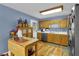 Bright kitchen featuring wood cabinets, laminate floor and stainless steel appliances at 524 Lambeth Dr, Hiram, GA 30141