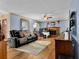 Open living room with hardwood floors, a fireplace, and a ceiling fan at 524 Lambeth Dr, Hiram, GA 30141