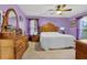 Bedroom with light purple walls, a ceiling fan and carpeted floors at 524 Lambeth Dr, Hiram, GA 30141