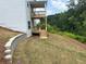 Lush backyard with a retaining wall and walkout decks, offering serene views at 363 Riverwood Pass, Dallas, GA 30157