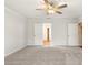 Large bedroom with carpet, ceiling fan and white trim, features double doors leading to connecting rooms at 363 Riverwood Pass, Dallas, GA 30157