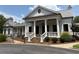 Beautiful clubhouse showcasing white brick, columns, and well-manicured landscaping at 363 Riverwood Pass, Dallas, GA 30157