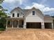 Stunning two-story new construction home with a welcoming front porch and attached two car garage at 363 Riverwood Pass, Dallas, GA 30157