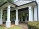 Open-air gazebo showcasing stone flooring, large pillars, and lush greenery, creating a peaceful retreat at 363 Riverwood Pass, Dallas, GA 30157