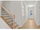Hallway featuring hardwood floors, white walls, and doors to other rooms in the home at 363 Riverwood Pass, Dallas, GA 30157
