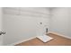 Empty laundry room with wire shelving and wood flooring, ready to be useful at 363 Riverwood Pass, Dallas, GA 30157