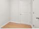 Small room with wood floors and white doors, ready to become a useful space at 363 Riverwood Pass, Dallas, GA 30157