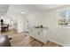 Small bar area with granite counter and shaker cabinets with a view of the backyard at 385 Jayne Ellen Way, Alpharetta, GA 30009