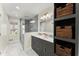 Spacious bathroom with a large glass shower, double vanity, decorative tile floor, and stylish storage shelves at 385 Jayne Ellen Way, Alpharetta, GA 30009