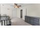 Inviting room with neutral decor, a ceiling fan, and a gray dresser providing a peaceful and versatile space at 385 Jayne Ellen Way, Alpharetta, GA 30009