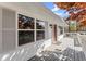 Charming home featuring a spacious porch, complemented by large windows and classic shutters at 385 Jayne Ellen Way, Alpharetta, GA 30009