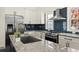 Renovated kitchen featuring stainless steel appliances, granite countertops and shaker cabinets at 385 Jayne Ellen Way, Alpharetta, GA 30009