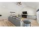 Bright living room with vaulted ceiling, hardwood floors, a sectional sofa and lots of natural light at 385 Jayne Ellen Way, Alpharetta, GA 30009