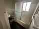 Functional bathroom with a shower-tub combo and ample natural light, ready for renovation at 3025 Mckenzie Rd, Atlanta, GA 30344