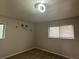 Bright bedroom featuring a ceiling fan and two windows, ready for your personal touch at 3025 Mckenzie Rd, Atlanta, GA 30344