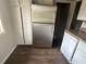 Stainless steel refrigerator and white cabinets and appliances in this kitchen provide a clean space at 3025 Mckenzie Rd, Atlanta, GA 30344