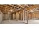 Unfinished basement with exposed framing, concrete floors, and plumbing at 373 Riverwood Pass, Dallas, GA 30157