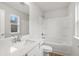 Bright bathroom features a shower, bath, and bright white cabinets at 373 Riverwood Pass, Dallas, GA 30157