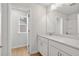 Bright bathroom features white cabinets, laminate floors, and shower with tub at 373 Riverwood Pass, Dallas, GA 30157