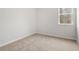 Neutral bedroom features a light-colored carpet and a large window at 373 Riverwood Pass, Dallas, GA 30157