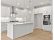 Beautiful modern kitchen with stainless appliances, a center island, and stylish pendant lighting at 373 Riverwood Pass, Dallas, GA 30157