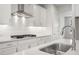 Modern kitchen features white cabinets, stainless steel appliances, and sleek countertops at 373 Riverwood Pass, Dallas, GA 30157