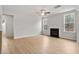 Spacious living room with a fireplace, large windows, and hardwood floors at 373 Riverwood Pass, Dallas, GA 30157