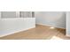 Bright, airy living room with light wood floors and white walls at 373 Riverwood Pass, Dallas, GA 30157