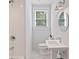 Compact bathroom featuring a shower, toilet, and a vanity, bathed in natural light at 88 Peachtree Memorial Nw Dr # 88, Atlanta, GA 30309