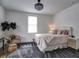 Cozy bedroom with a comfortable bed, accent chair, and decorative chandelier at 88 Peachtree Memorial Nw Dr # 88, Atlanta, GA 30309