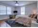 Well-lit bedroom with two windows, a comfortable bed, and stylish decor at 88 Peachtree Memorial Nw Dr # 88, Atlanta, GA 30309